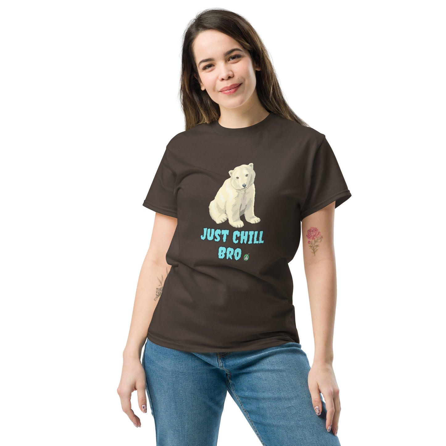 A woman standing and wearing a brown t-shirt with a printed graphic of a bear with the words, 'Just Chill Bro'. Designed by Wizard Prints.