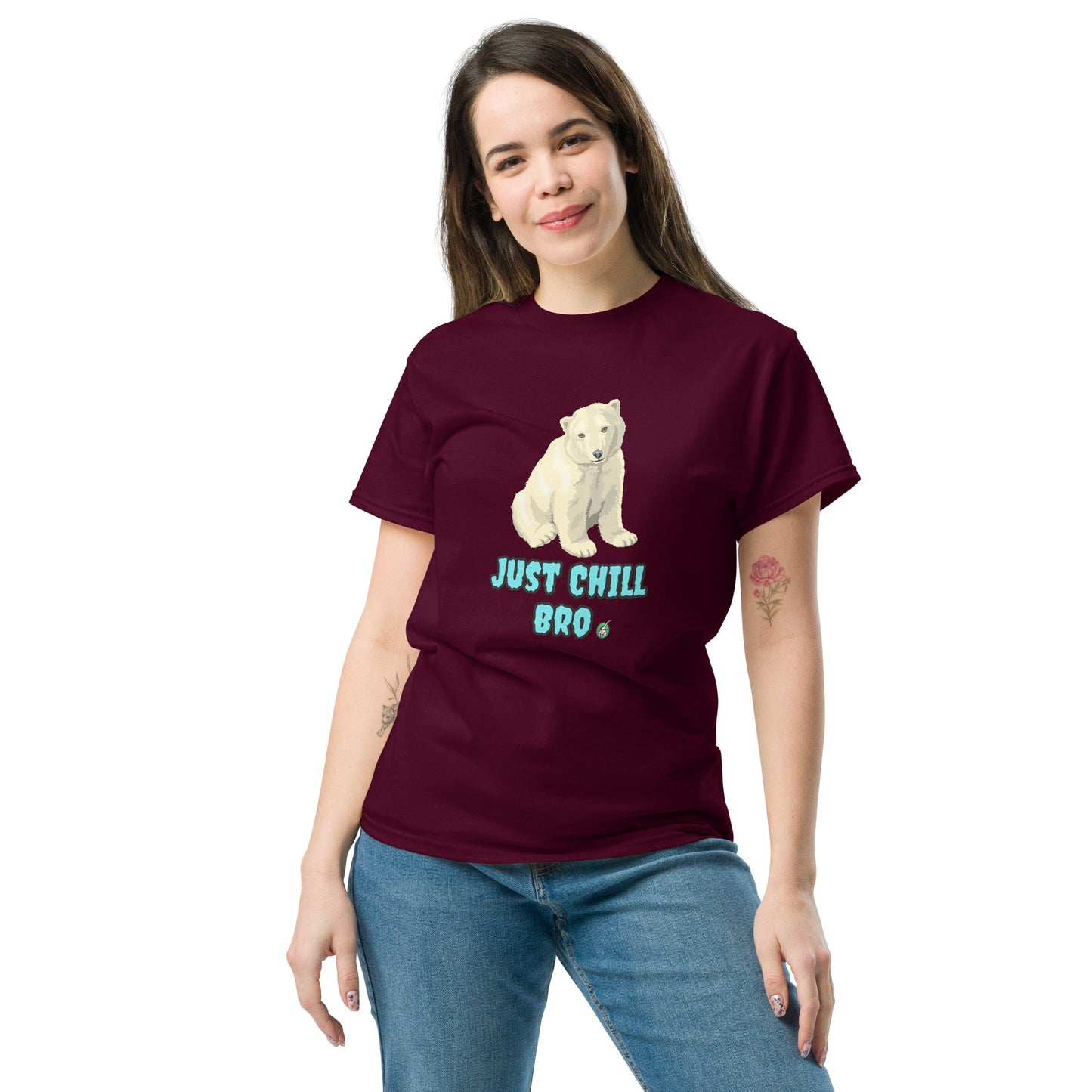 A woman standing and wearing a maroon t-shirt with a printed graphic of a bear with the words, 'Just Chill Bro'. Designed by Wizard Prints.
