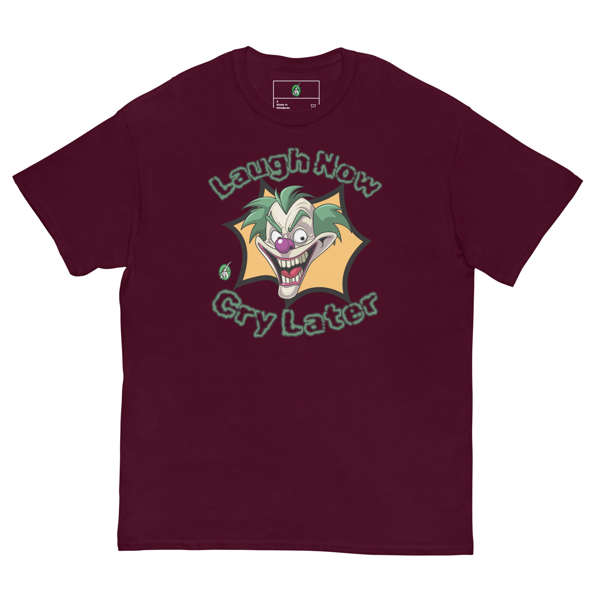 Women's maroon t-shirt with a printed graphic of a clown with the words, 'Laugh Now, Cry Later'. Designed by Wizard Prints.