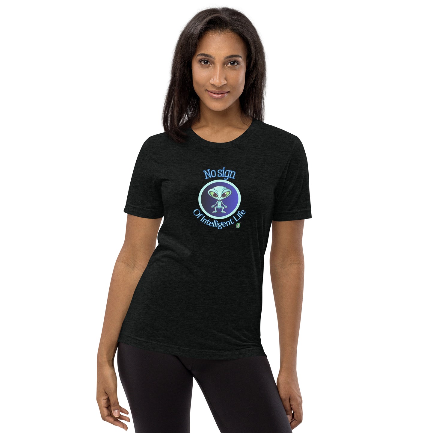 A woman standing wearing a black tee shirt with a printed graphic of a blue alien and the words No Sign of Intelligent Life. Designed by Wizard Prints