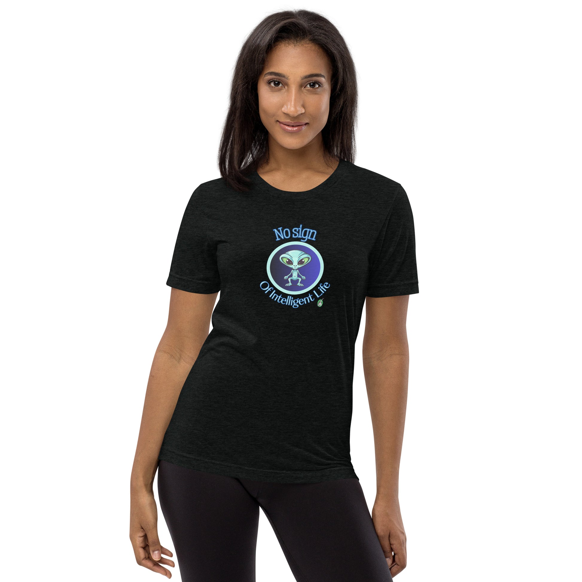 A woman standing wearing a black tee shirt with a printed graphic of a blue alien and the words No Sign of Intelligent Life. Designed by Wizard Prints