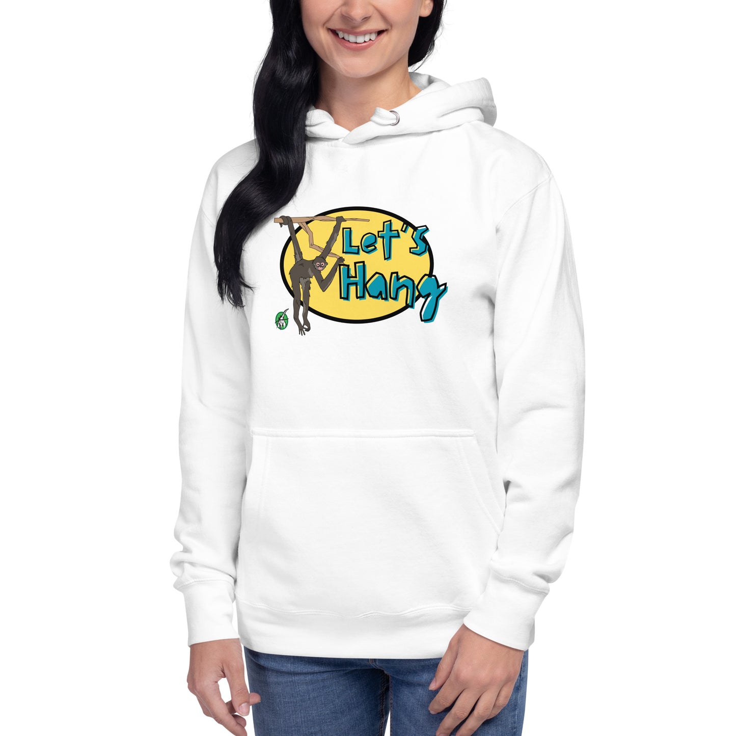 A woman standing wearing a white hoodie with a printed graphic of a monkey hanging on a branch with the words, Let's Hang. Designed by Wizard Prints.