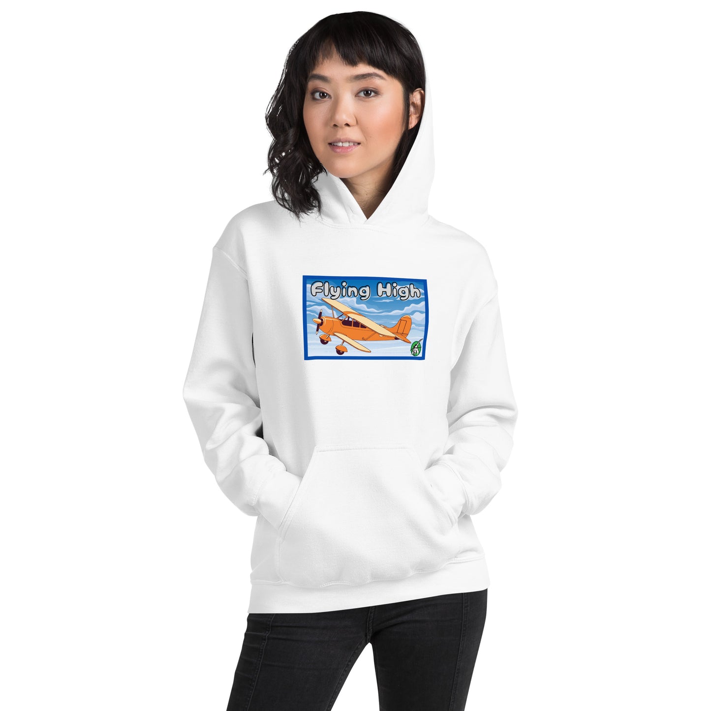 A woman standing wearing a white hoodie with the printed graphic of a vintage airplane and the words, Flying High, by Wizard Prints