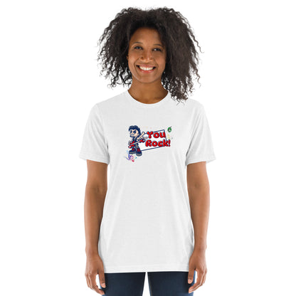 A woman standing wearing a white t-shirt by Wizard Prints featuring a printed graphic of a rock singer holding an electric guitar and the words, You Rock!