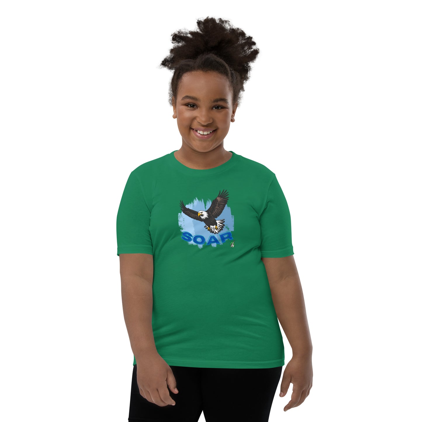 A girl wearing a Wizard Prints kids t-shirt in green with a printed graphic on the front of an eagle soaring in the sky.