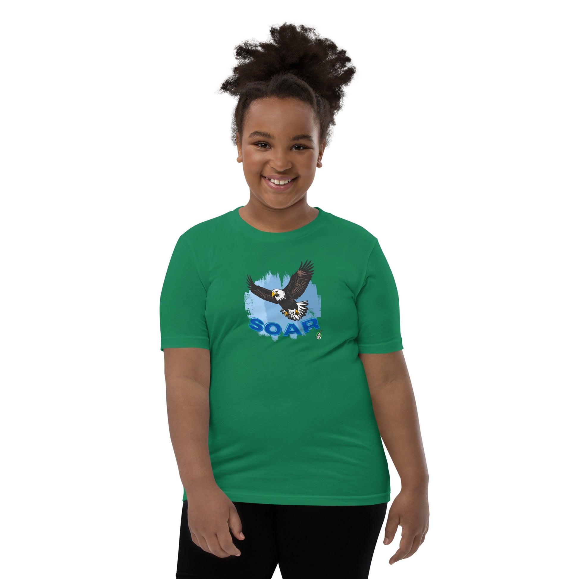 A girl wearing a Wizard Prints kids t-shirt in green with a printed graphic on the front of an eagle soaring in the sky.